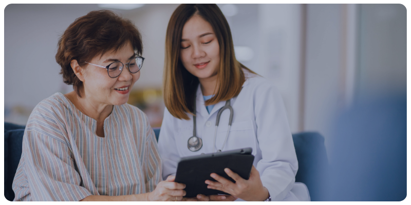 Doctor meeting with patient after receiving patient information by text message from another physician