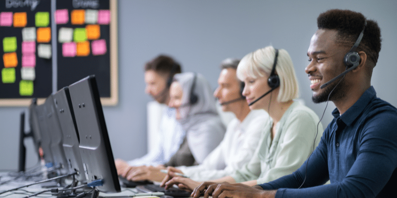 smiling employees at a call center