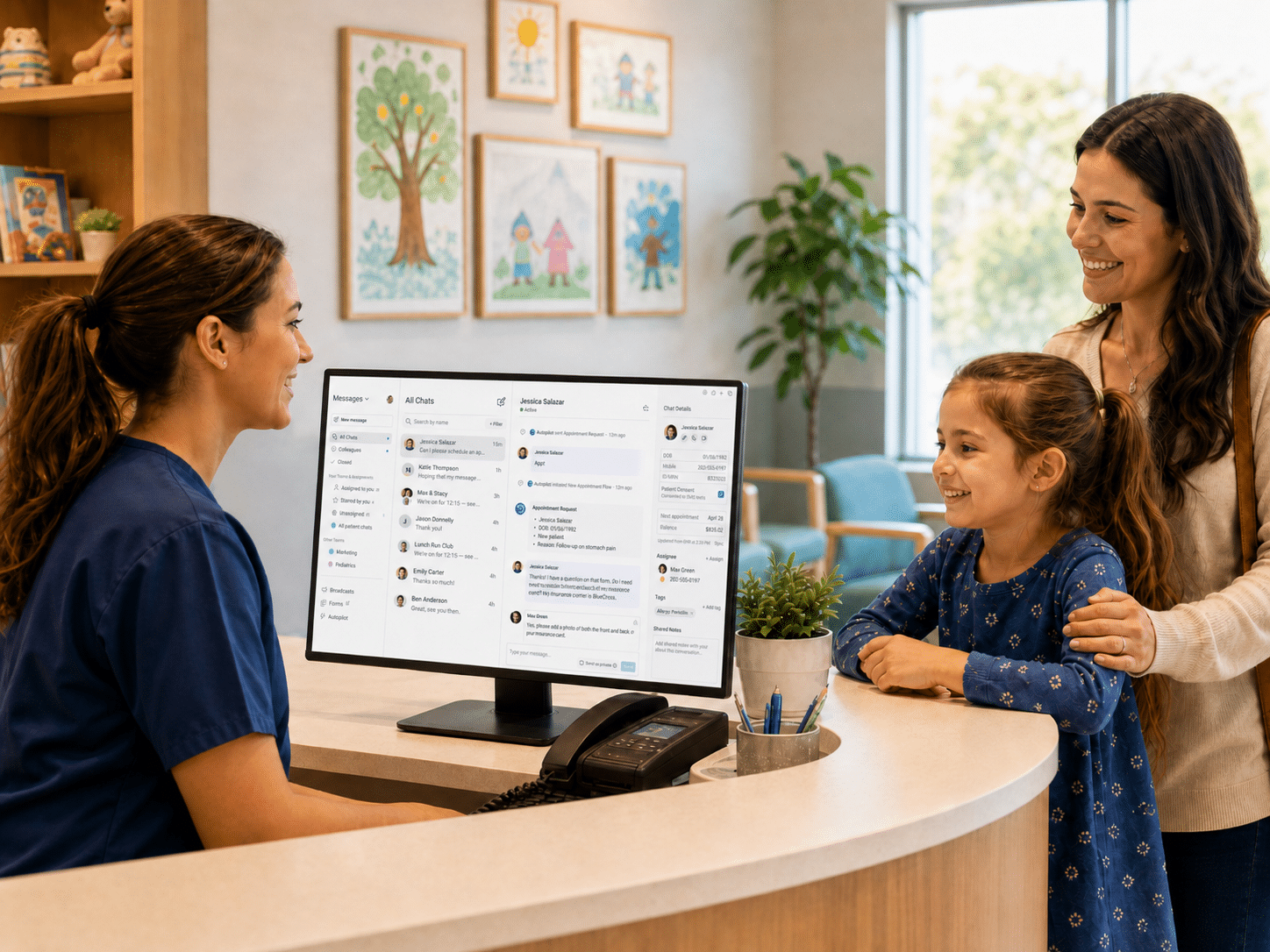 Mother and daughter speaking with a pediatric front desk staff member while viewing the OhMD patient communication platform.